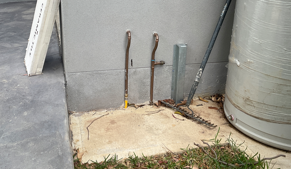 Photo image 2 of another non-compliant installation showing gas multilayer pipe installed external to a building
